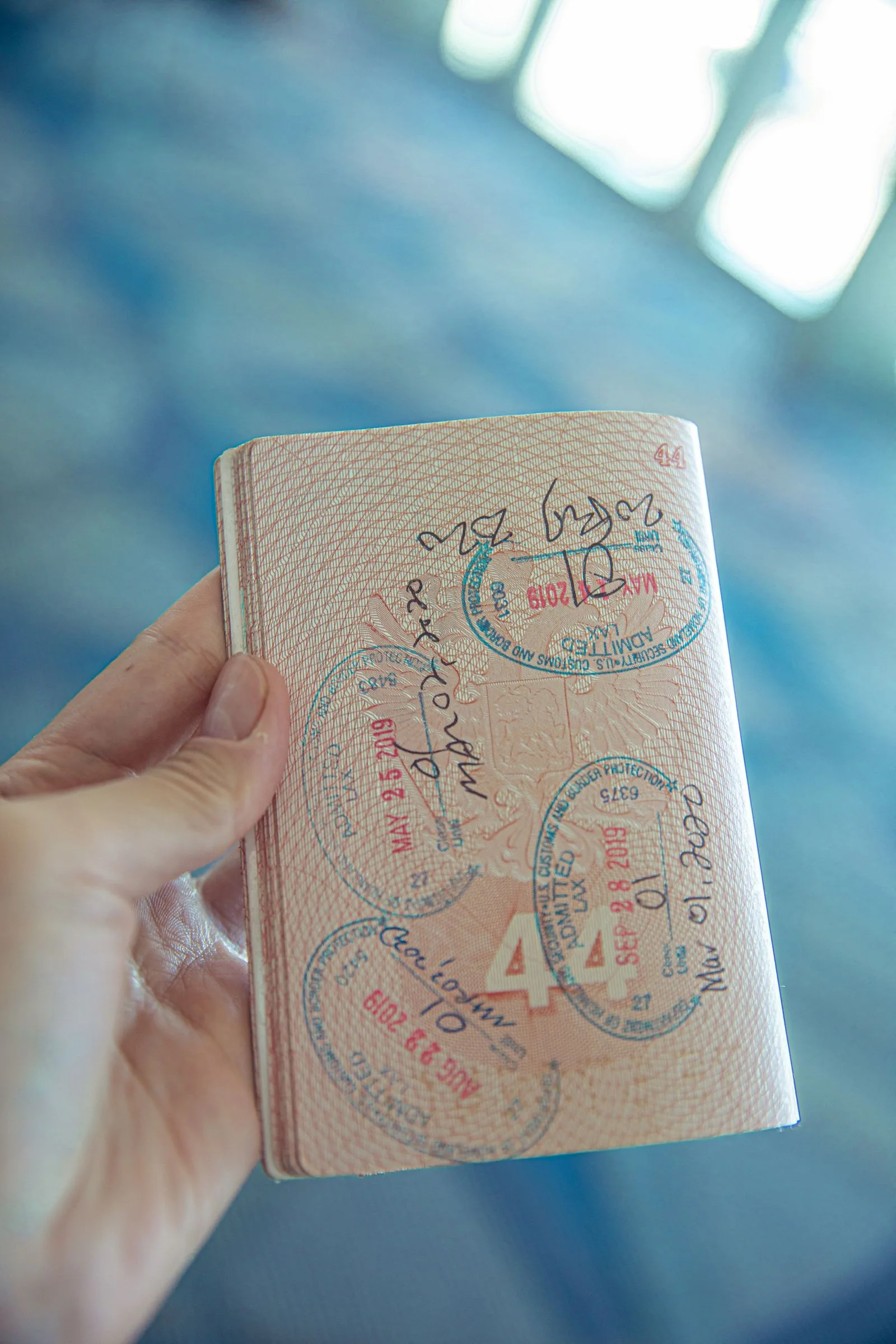 Open passport photographed on a table