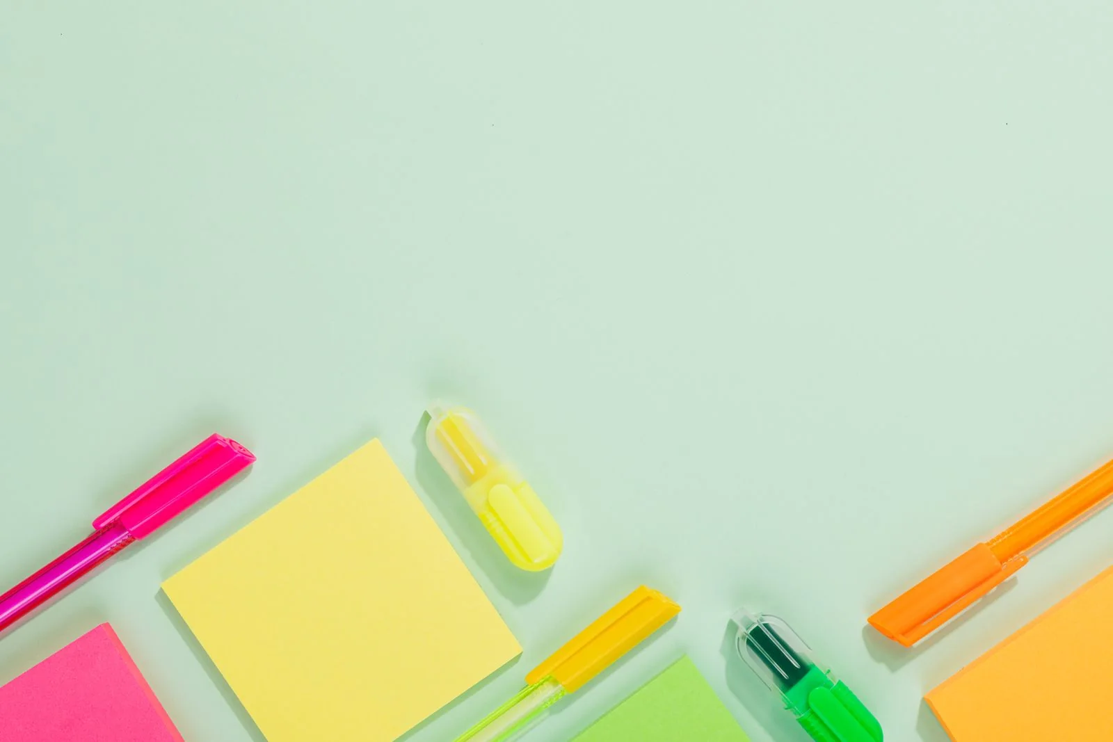 Brightly coloured pens and office stationery